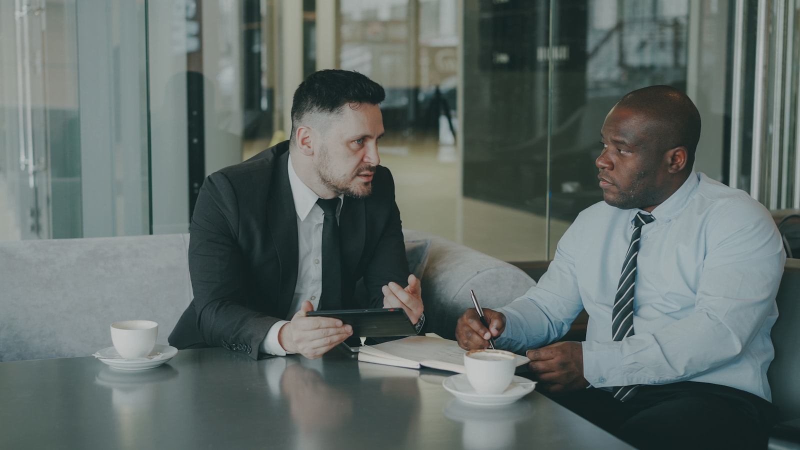 Two people having a mentoring conversation over coffee